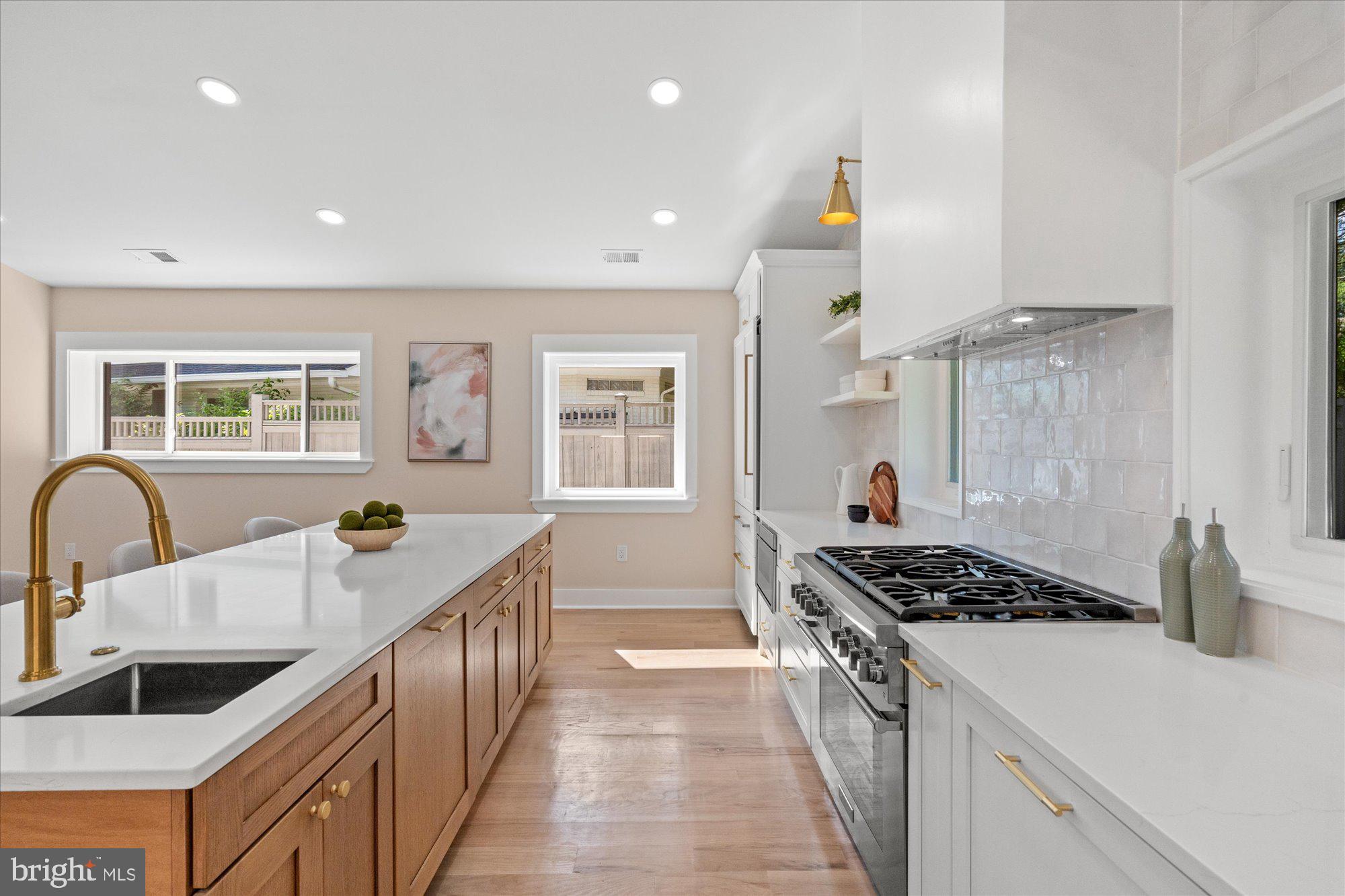 6125 Overlea Road Bethesda, MD 20816 - Photo 22 of 61 a kitchen with granite countertop a stove and a sink