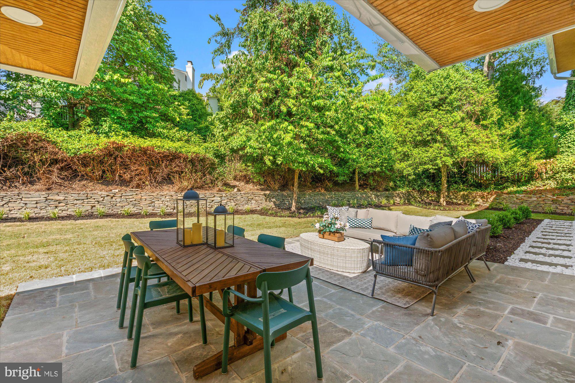 6125 Overlea Road Bethesda, MD 20816 - Photo 26 of 61 a backyard of a house with outdoor seating