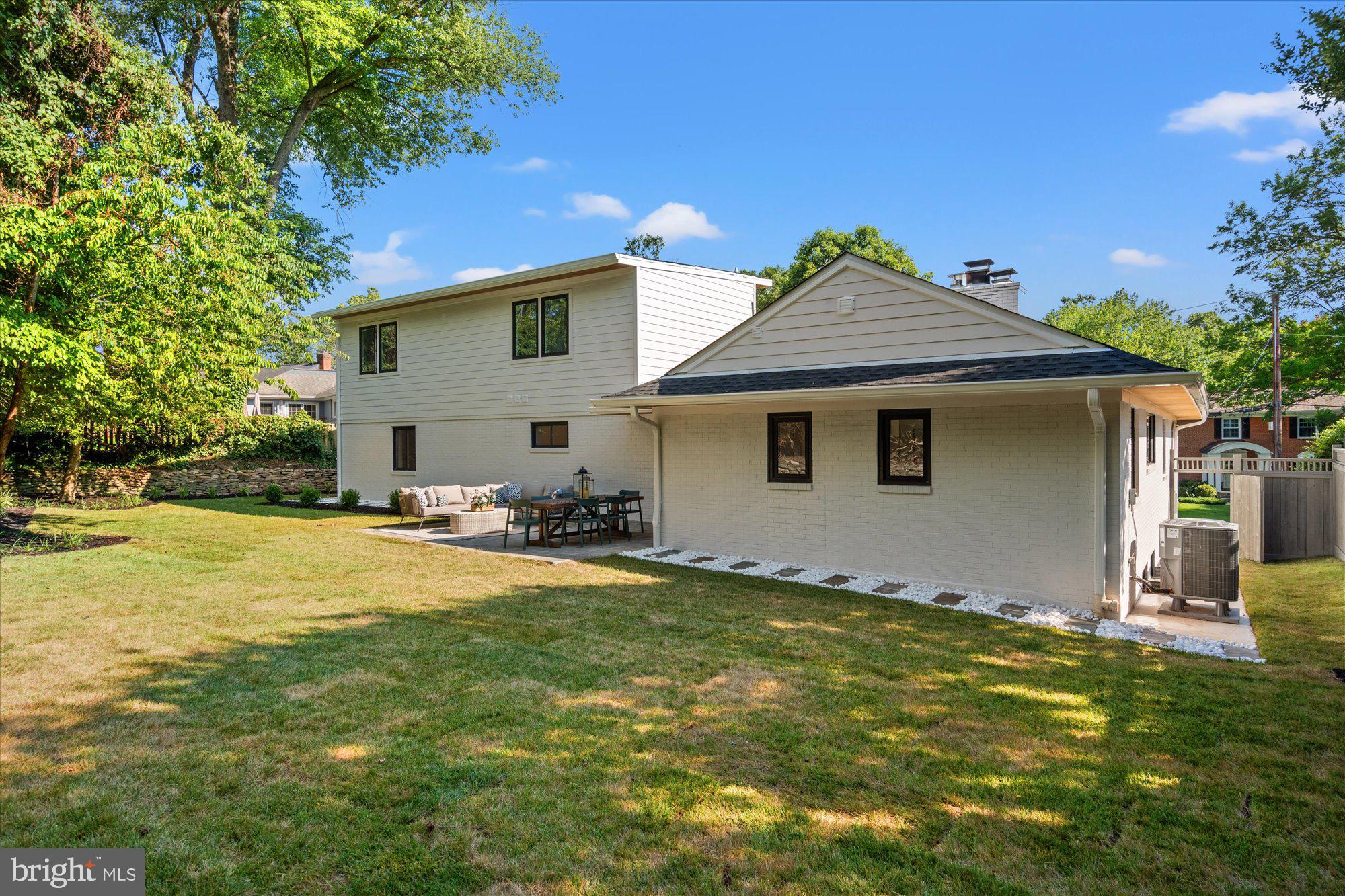 6125 Overlea Road Bethesda, MD 20816 - Photo 29 of 61 a view of a house with a yard and sitting area