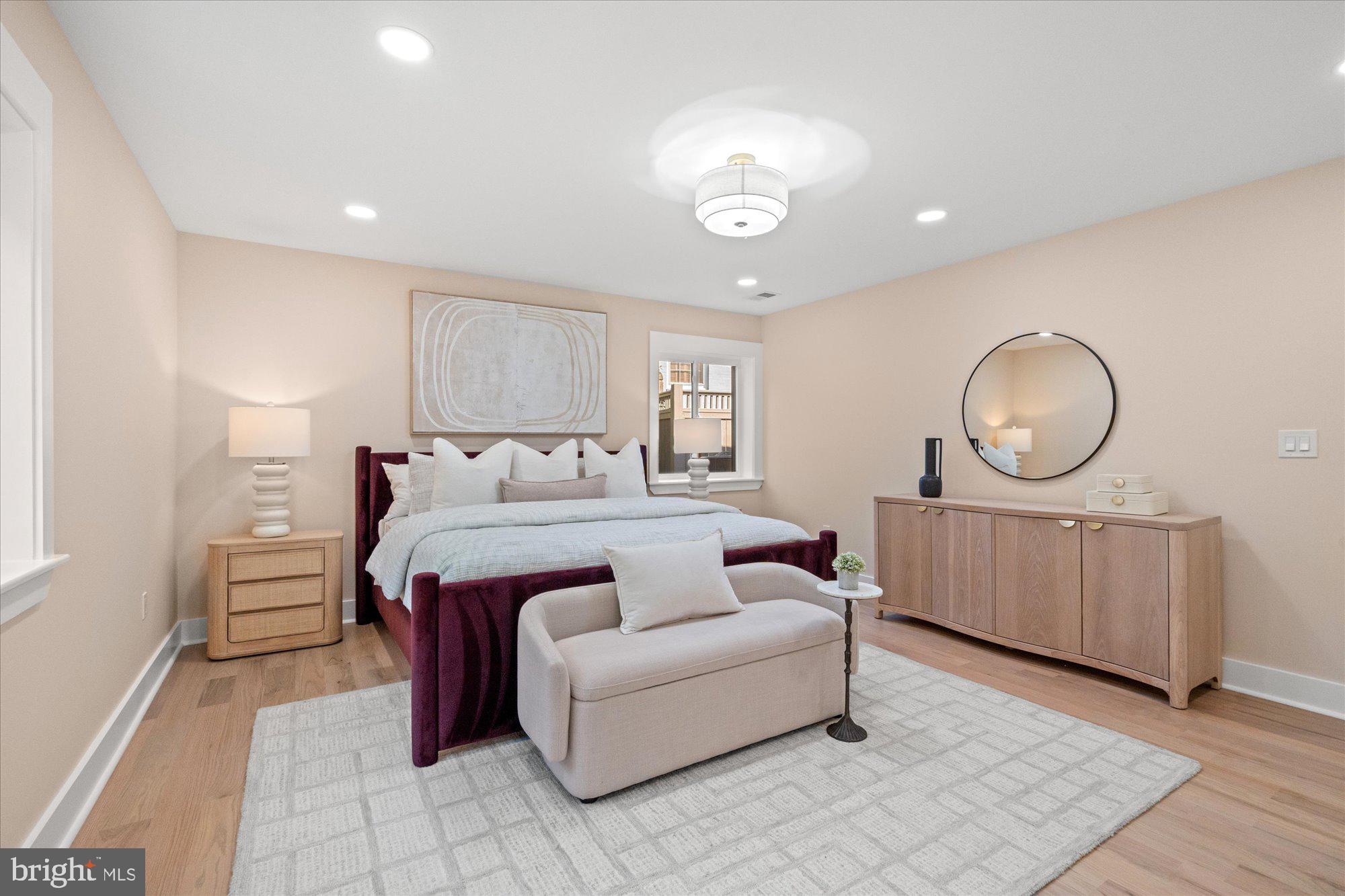 6125 Overlea Road Bethesda, MD 20816 - Photo 31 of 61 a bed room with a bed mirror and a dresser