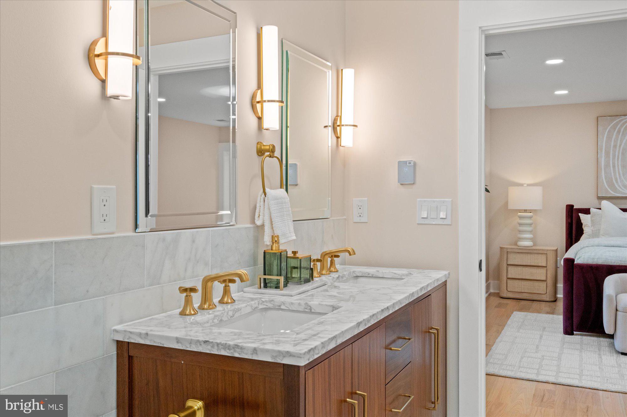 6125 Overlea Road Bethesda, MD 20816 - Photo 36 of 61 a bathroom with a granite countertop sink and a mirror