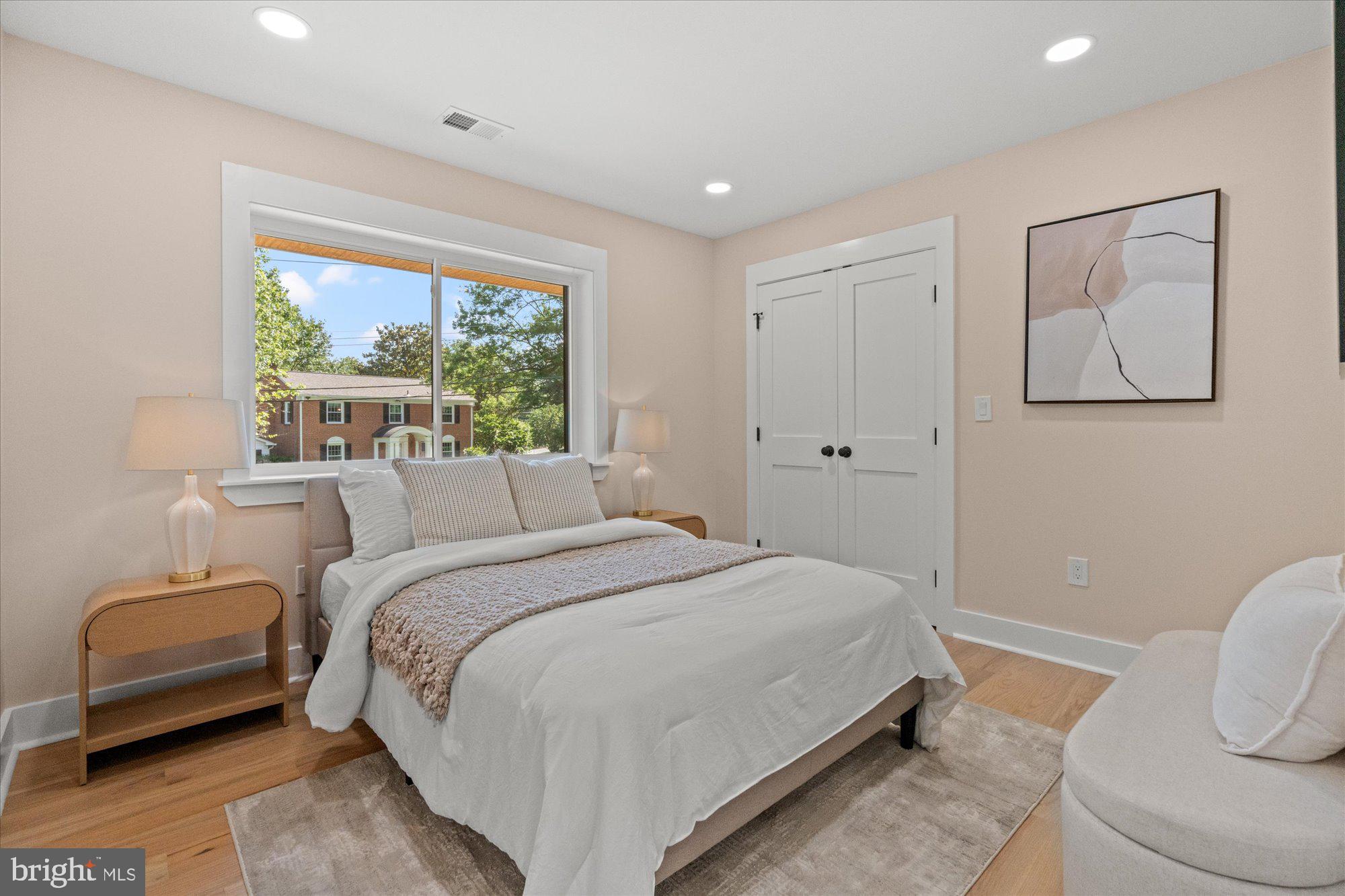 6125 Overlea Road Bethesda, MD 20816 - Photo 40 of 61 a bedroom with a bed and a couch