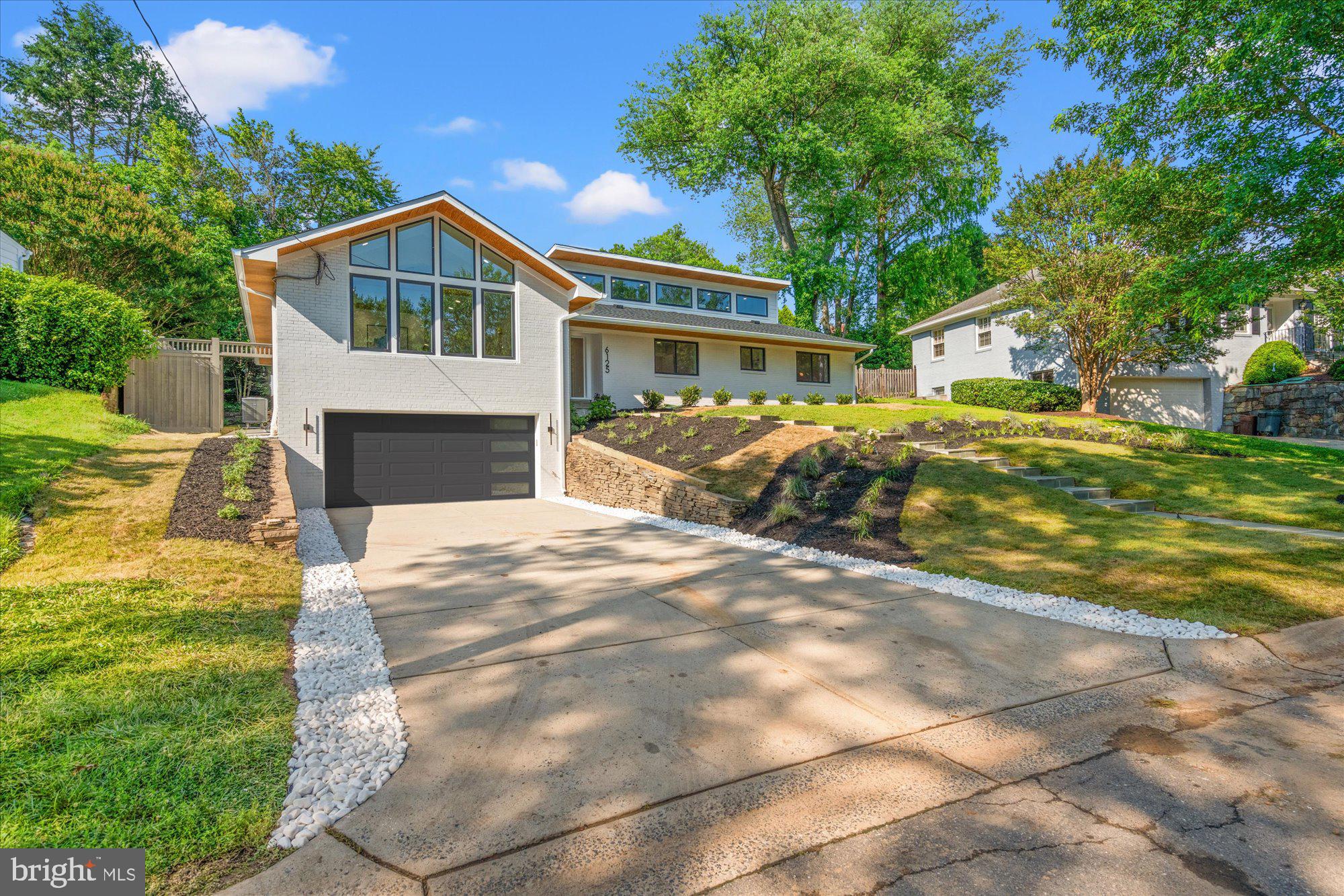 6125 Overlea Road Bethesda, MD 20816 - Photo 4 of 61 a front view of a house with a yard