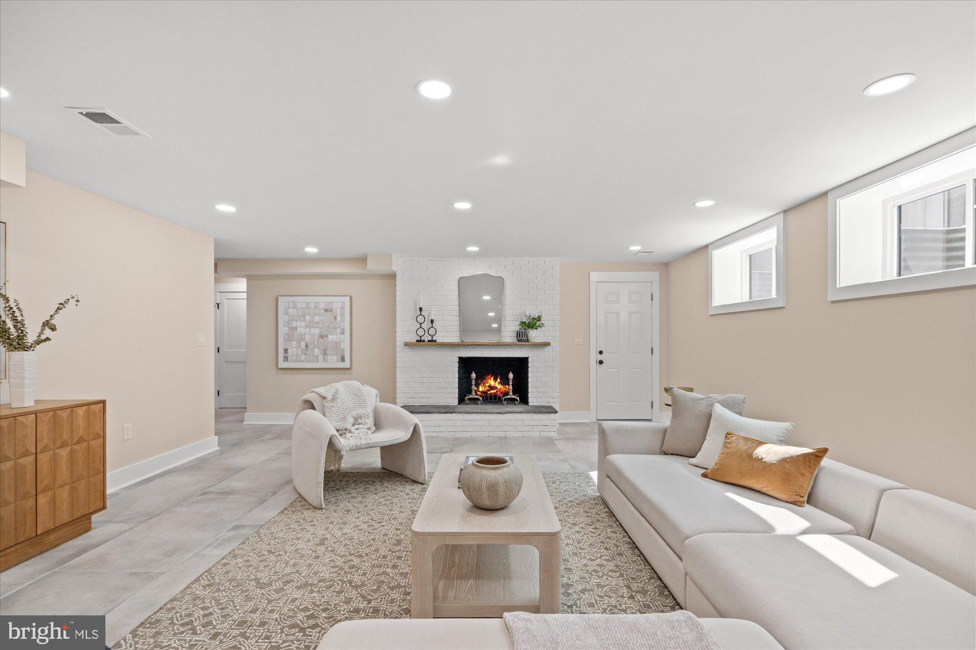 6125 Overlea Road Bethesda, MD 20816 - Photo 53 of 61 a living room with furniture and a fireplace
