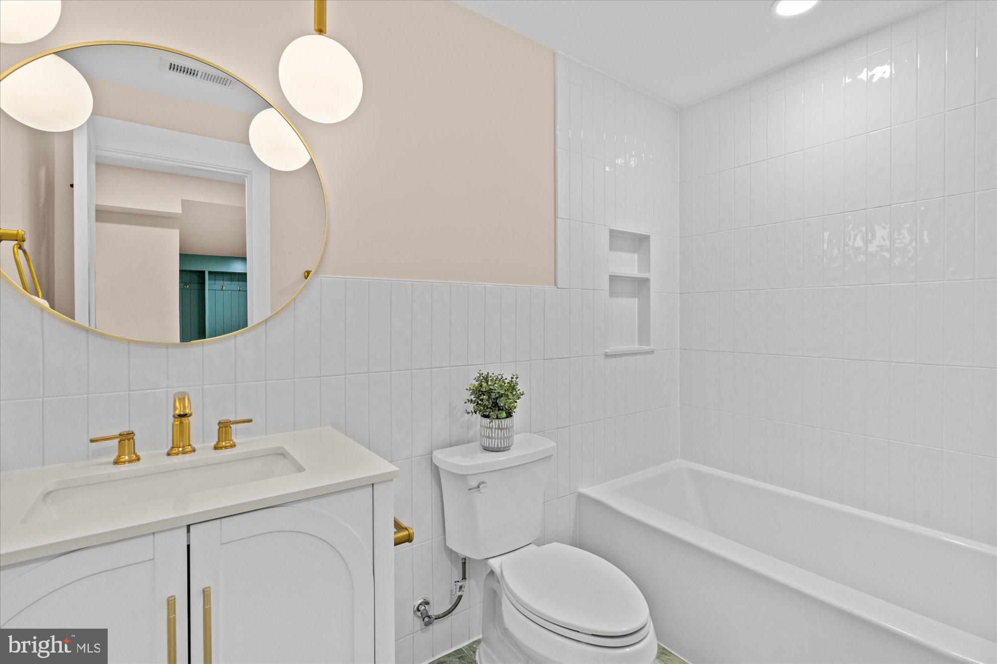 6125 Overlea Road Bethesda, MD 20816 - Photo 59 of 61 a bathroom with a sink a toilet a mirror and shower