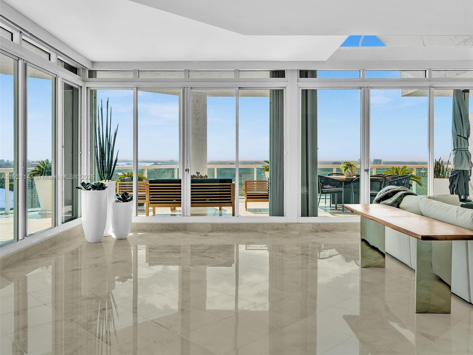 16500 Collins Avenue, Unit PH54 Sunny Isles Beach, FL 33160 - Photo 17 of 97 a view of a room with a large window