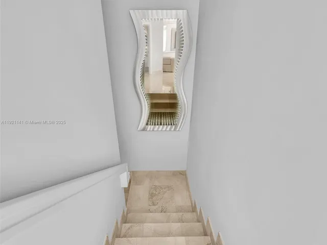 a bathroom with a toilet and shower