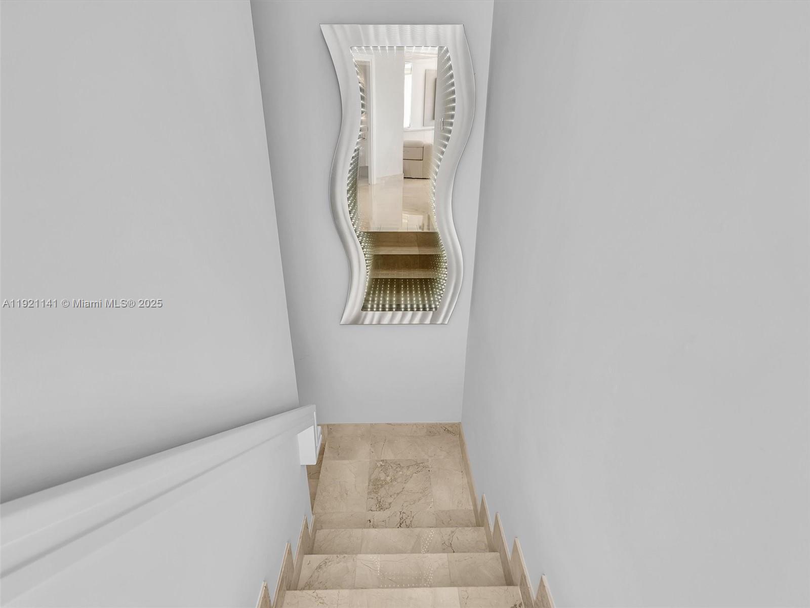 16500 Collins Avenue, Unit PH54 Sunny Isles Beach, FL 33160 - Photo 43 of 97 a view of staircase with white walls and a window