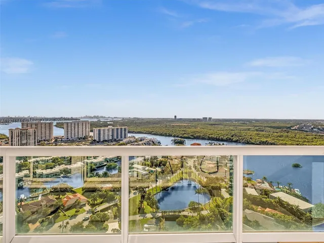 a large kitchen with a table and chairs