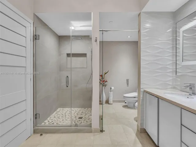 a view of a chairs and table in backyard of the house