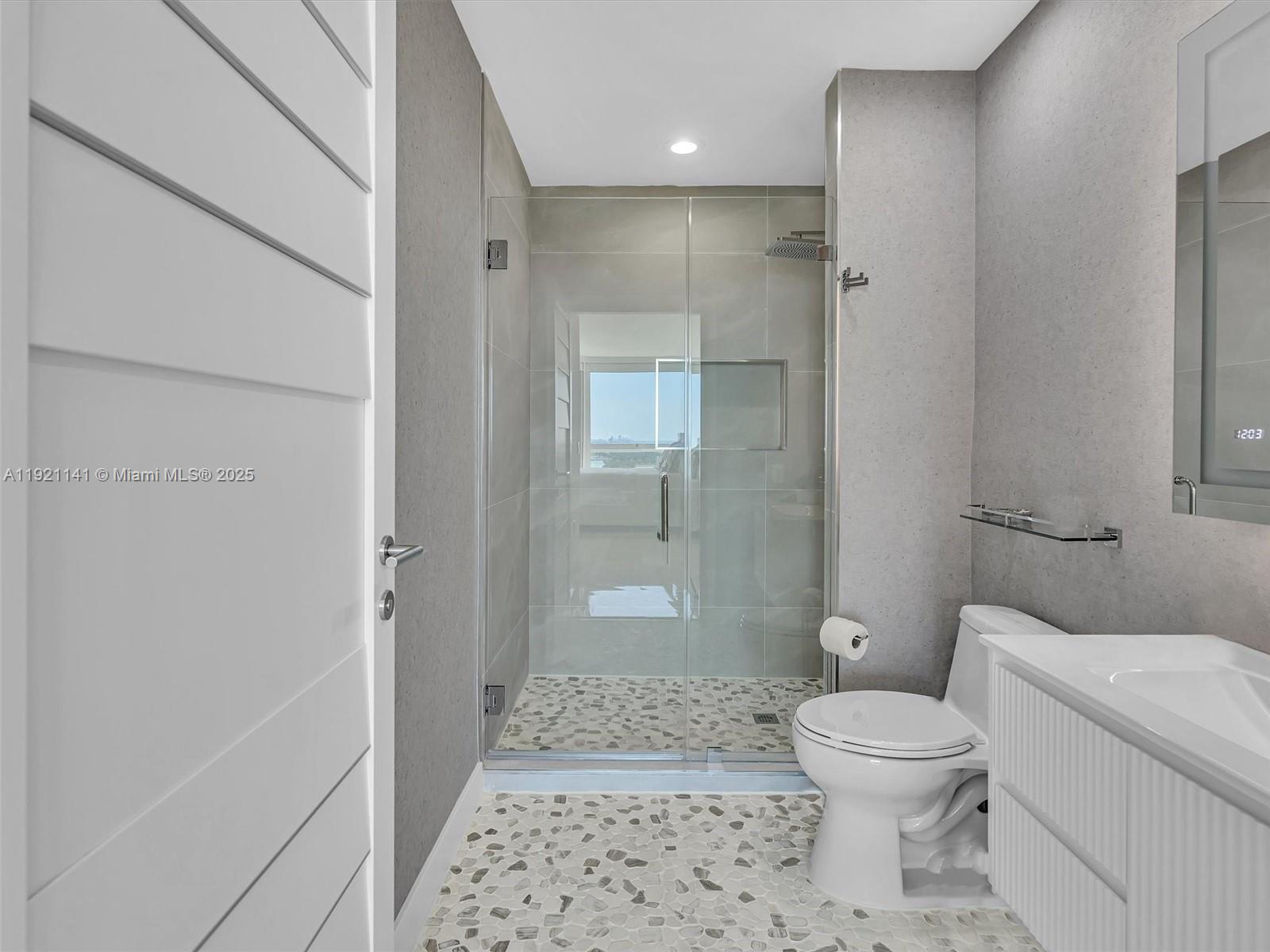 16500 Collins Avenue, Unit PH54 Sunny Isles Beach, FL 33160 - Photo 78 of 97 a bathroom with a toilet and shower