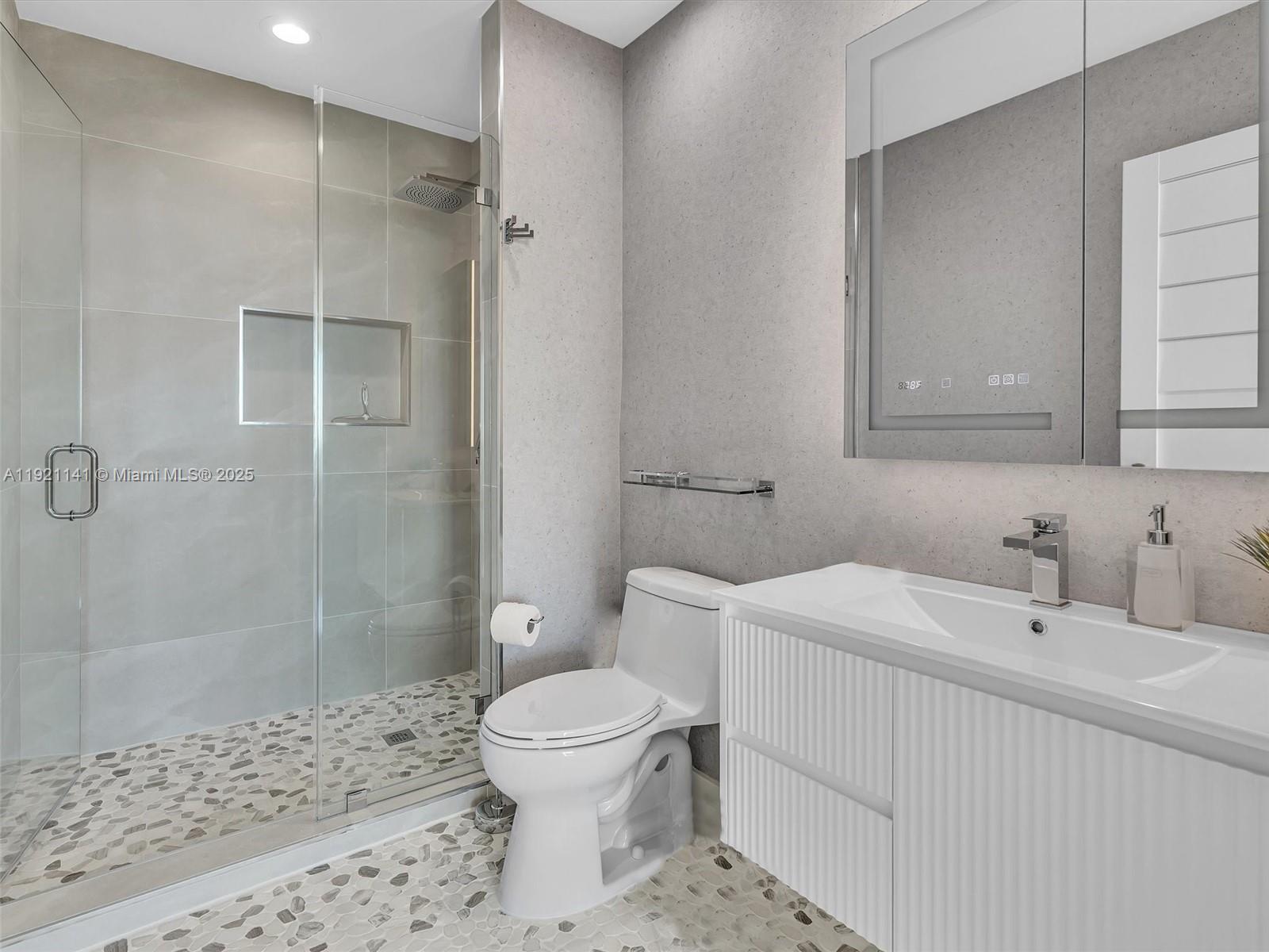 16500 Collins Avenue, Unit PH54 Sunny Isles Beach, FL 33160 - Photo 79 of 97 a bathroom with a sink toilet and shower