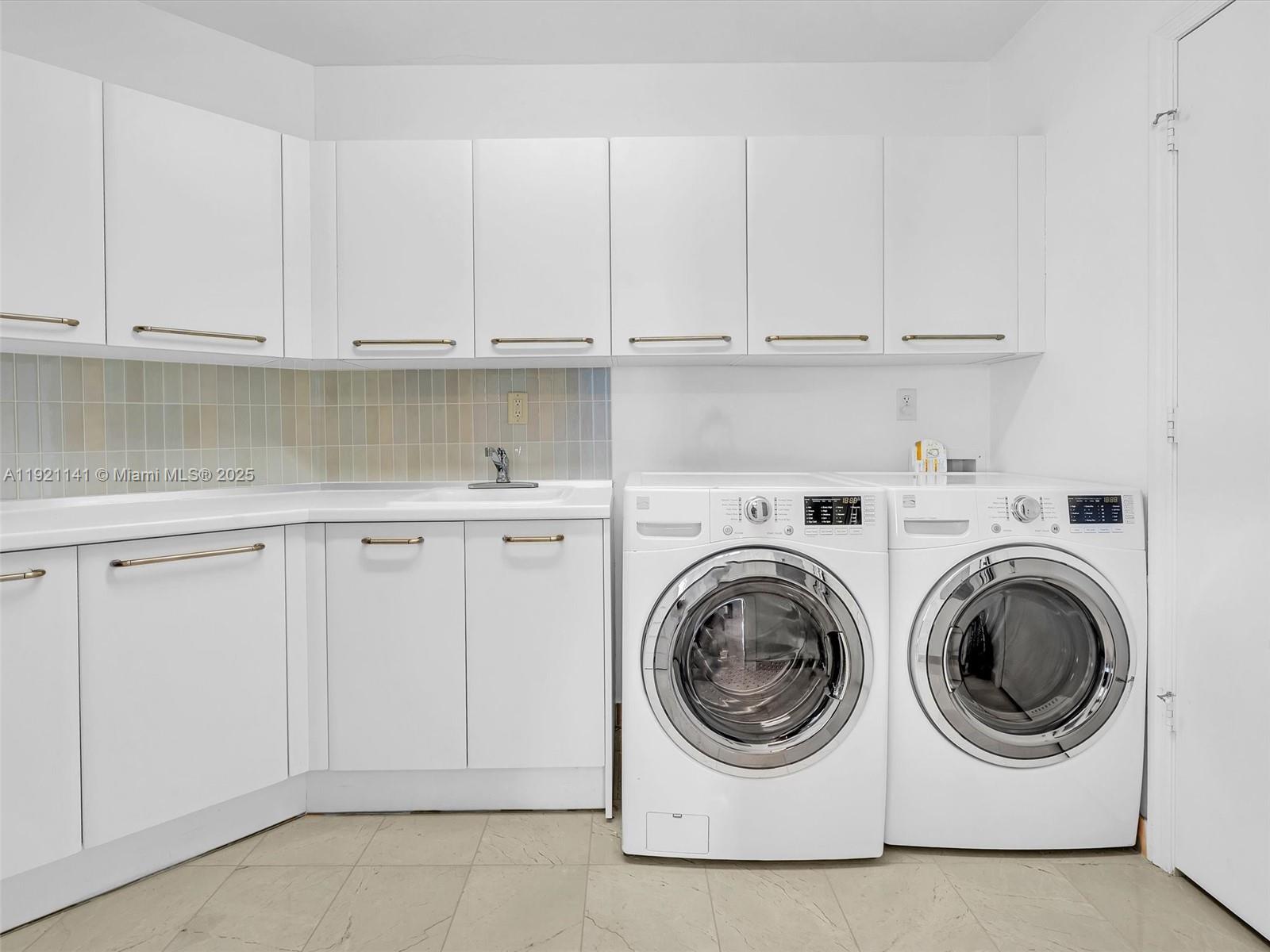 16500 Collins Avenue, Unit PH54 Sunny Isles Beach, FL 33160 - Photo 80 of 97 a utility room with sink dryer and washer