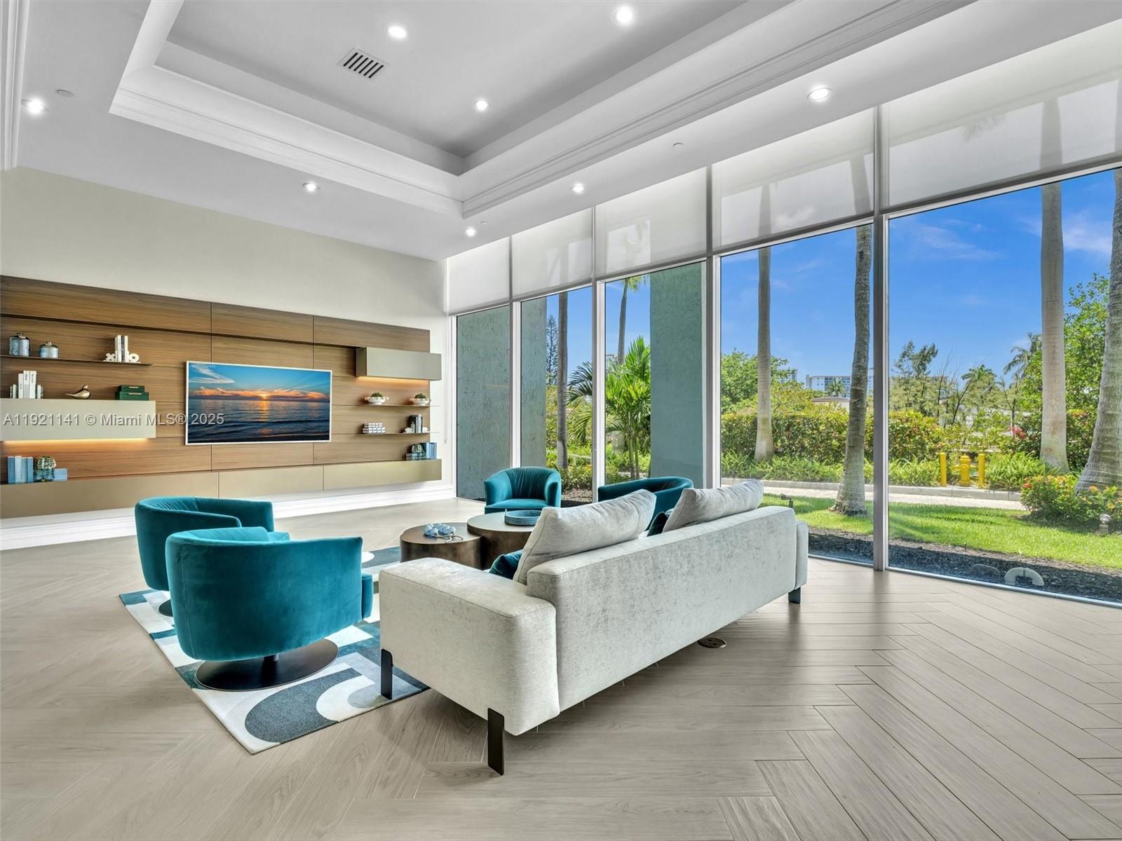 16500 Collins Avenue, Unit PH54 Sunny Isles Beach, FL 33160 - Photo 84 of 97 a living room with furniture and a flat screen tv