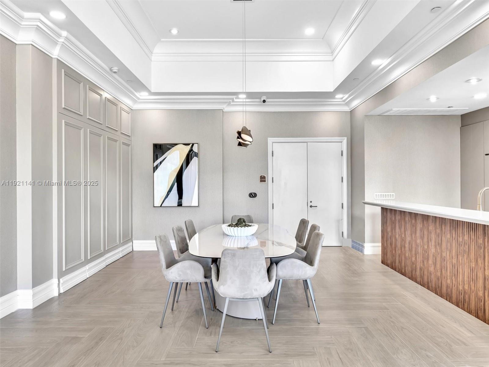 16500 Collins Avenue, Unit PH54 Sunny Isles Beach, FL 33160 - Photo 88 of 97 a view of a dining room with furniture and wooden floor