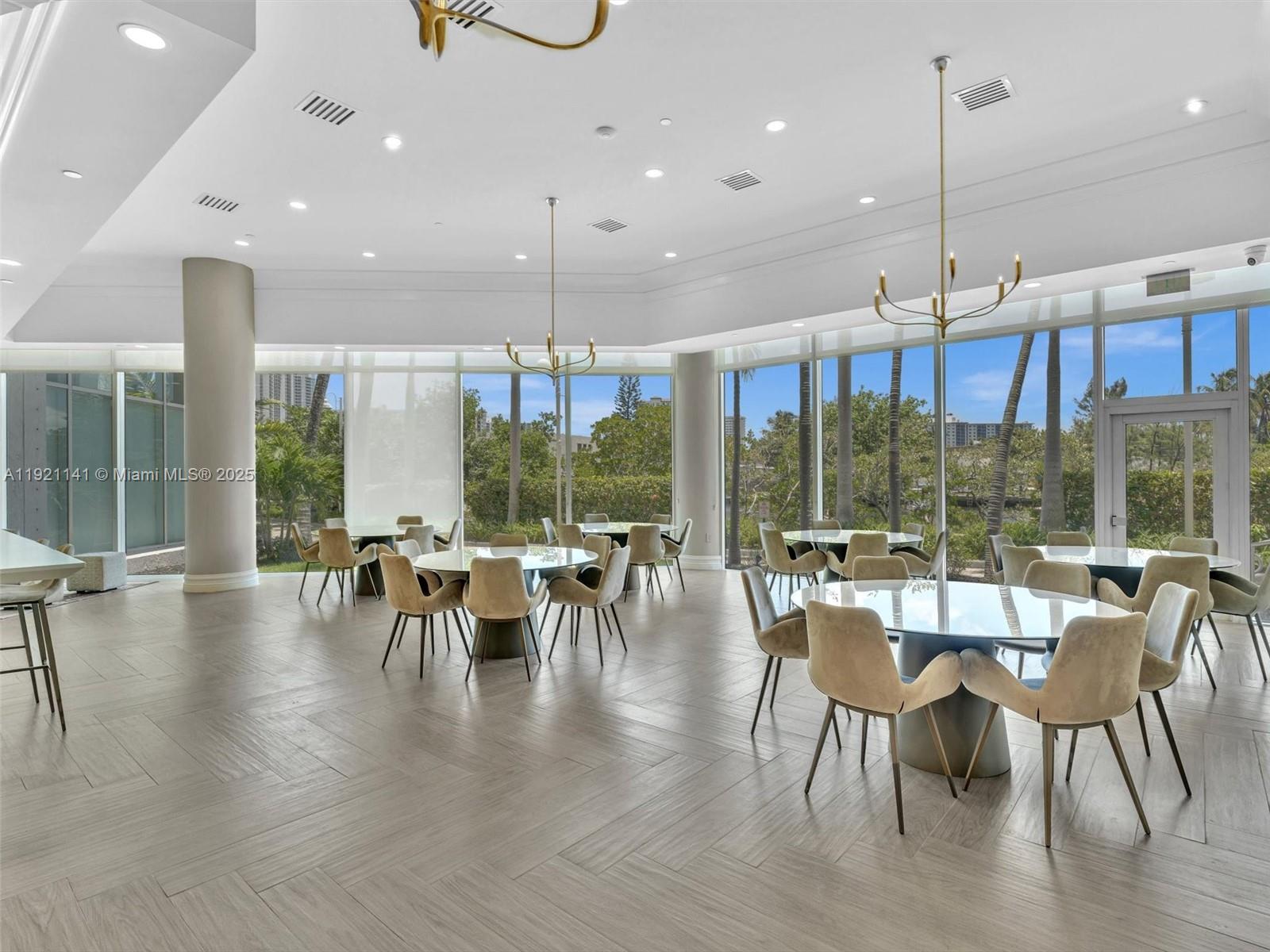 16500 Collins Avenue, Unit PH54 Sunny Isles Beach, FL 33160 - Photo 90 of 97 a view of a dining room with furniture window and outside view