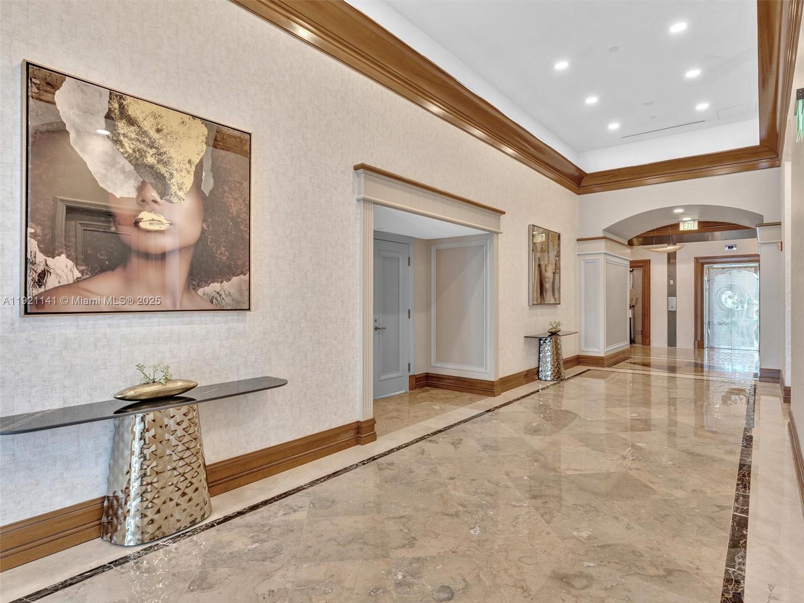 16500 Collins Avenue, Unit PH54 Sunny Isles Beach, FL 33160 - Photo 92 of 97 a view of a hallway with wooden floor and door