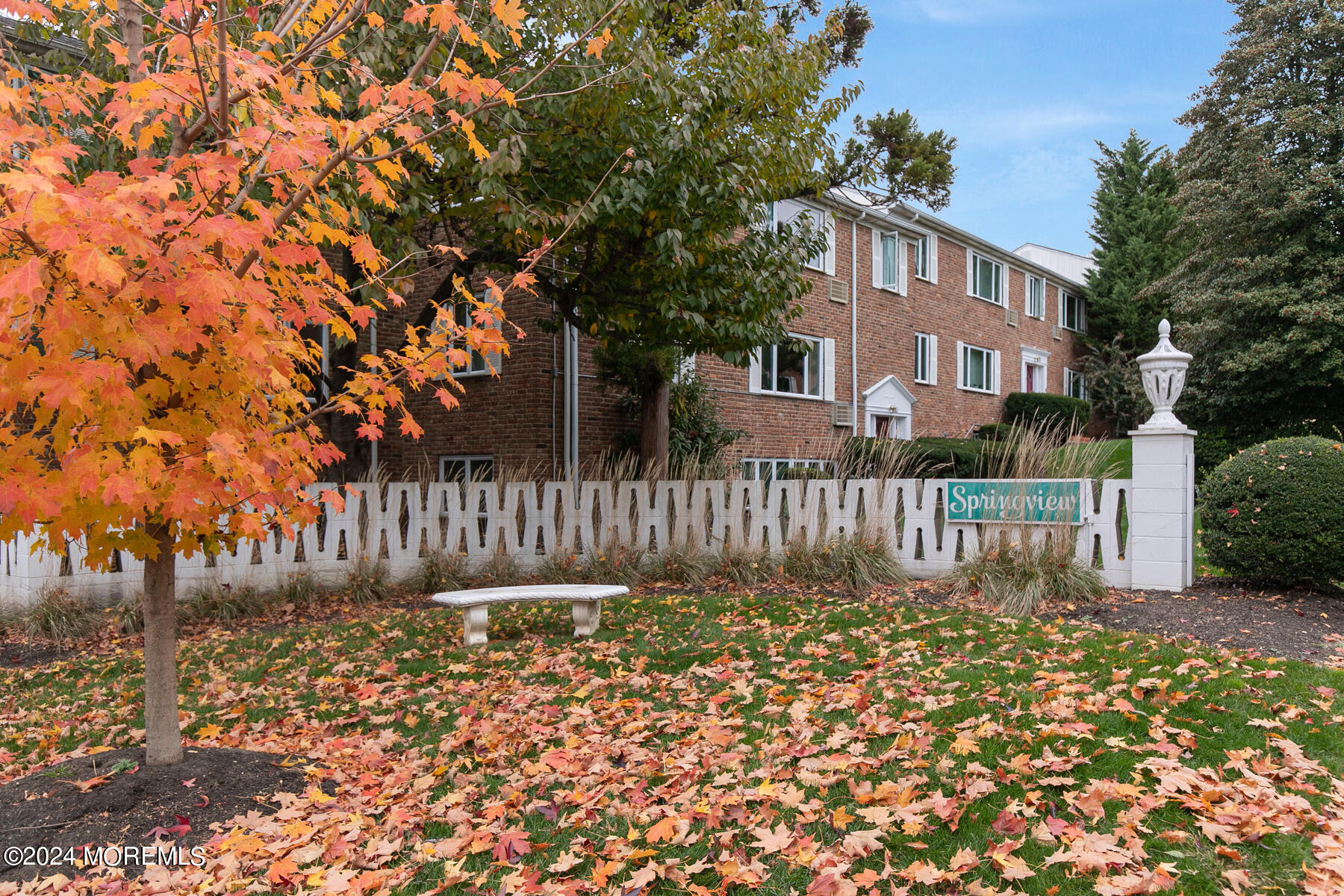 283 Spring Street, Unit 7A Red Bank, NJ 07701 - Photo 27 of 29 a front view of a house with a fence
