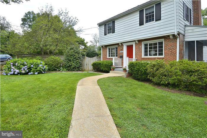 6001 Conway Road Bethesda, MD 20817 - Photo 2 of 26 a front view of a house with a yard