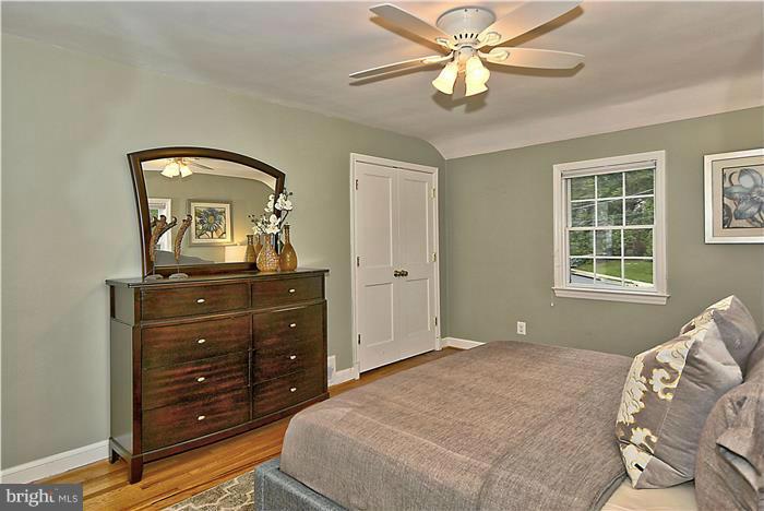 6001 Conway Road Bethesda, MD 20817 - Photo 14 of 26 a bedroom with a bed and a mirror on the dresser