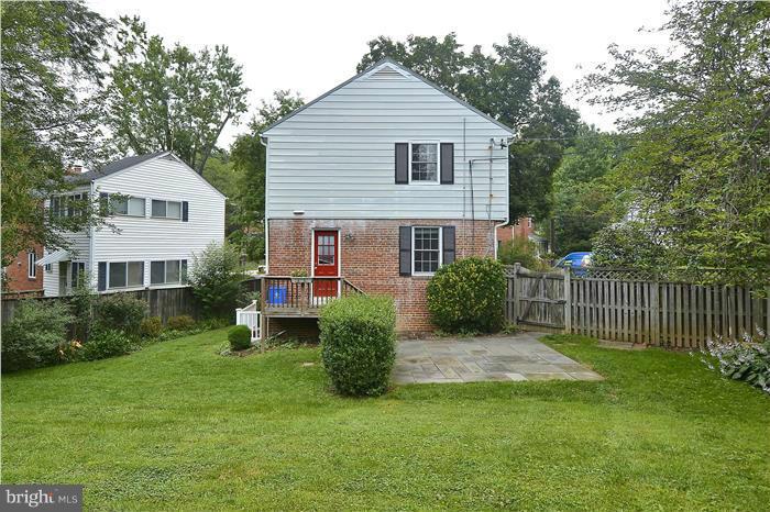 6001 Conway Road Bethesda, MD 20817 - Photo 3 of 26 a front view of a house with a yard and porch