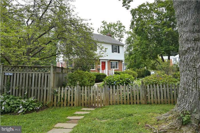 6001 Conway Road Bethesda, MD 20817 - Photo 5 of 26 a front view of a house with a garden
