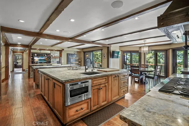 a dining room with furniture and wooden floor