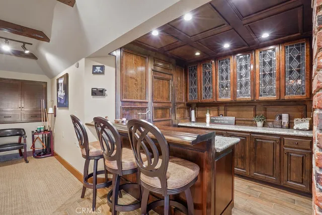 a view of a glass door with a balcony from a window