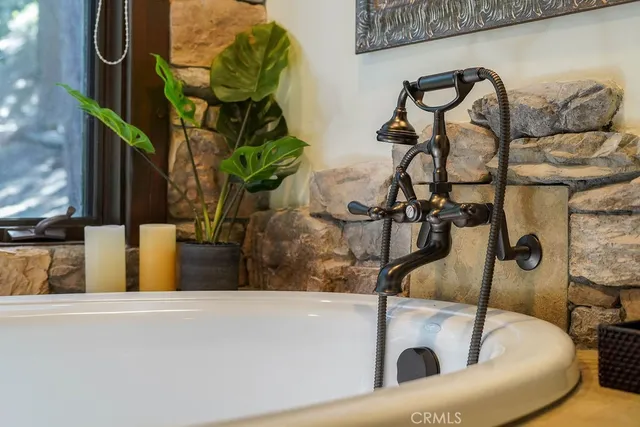 a dining room with furniture and a large window