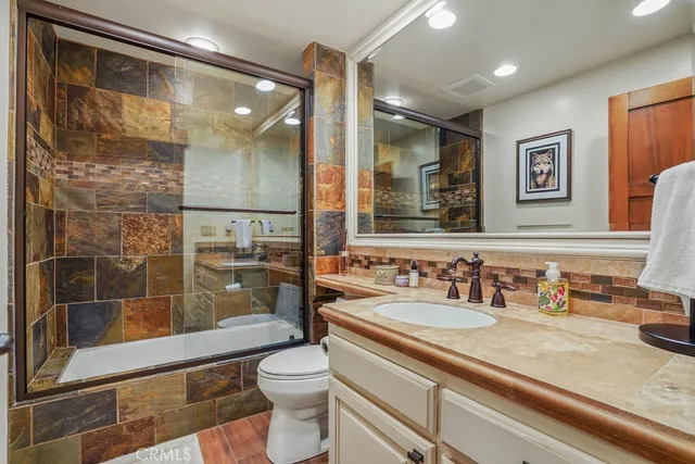 a spacious bedroom with a bed and a large window