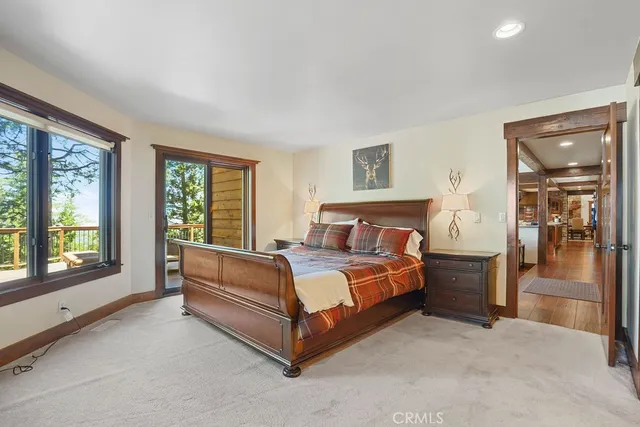 a bedroom with a bed and a fireplace