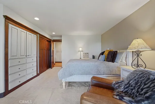 an aerial view of a house with a yard and outdoor seating