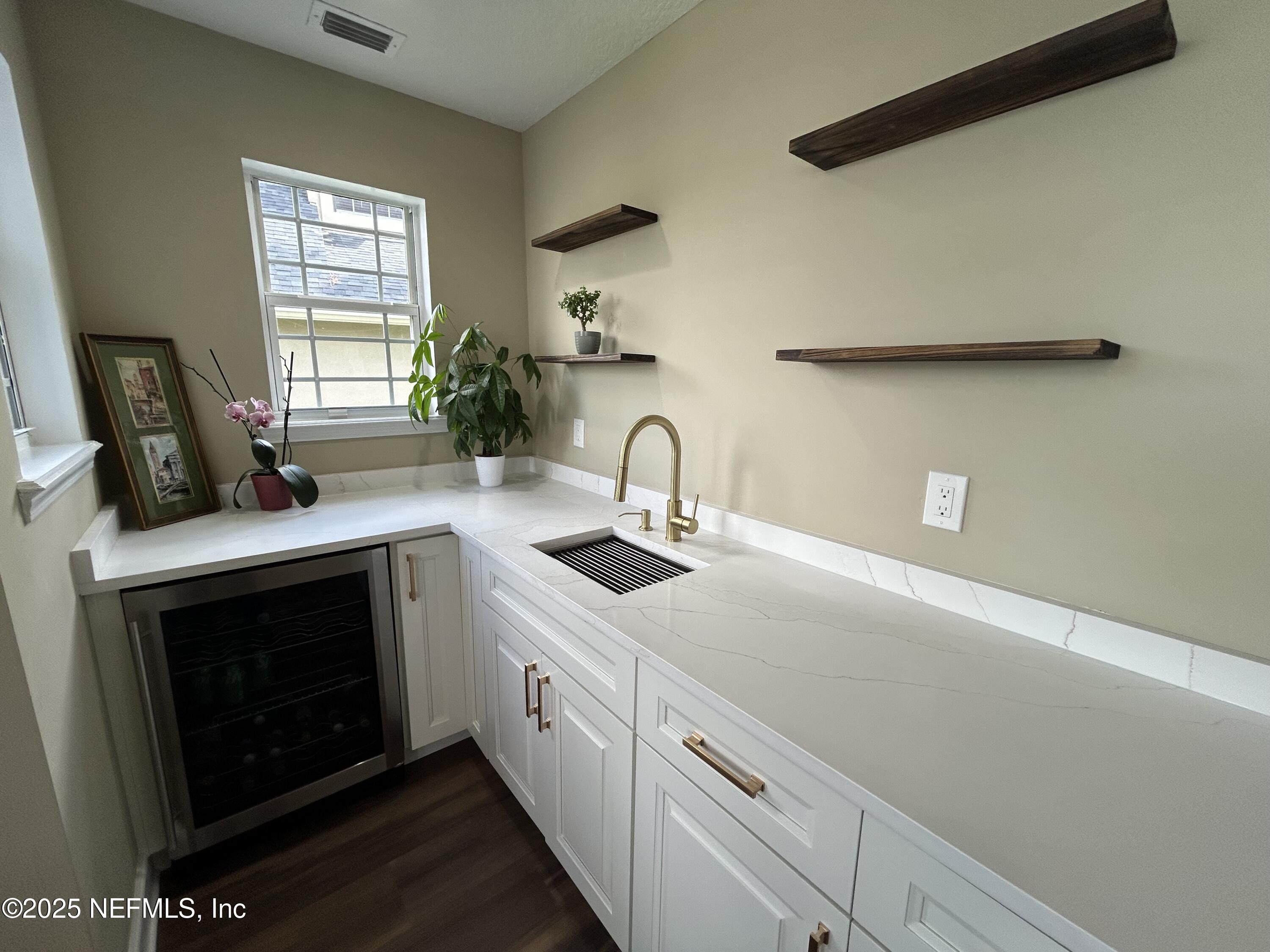 1764 Eagle Watch Drive Fleming Island, FL 32003 - Photo 14 of 41 a kitchen with sink stove and cabinets