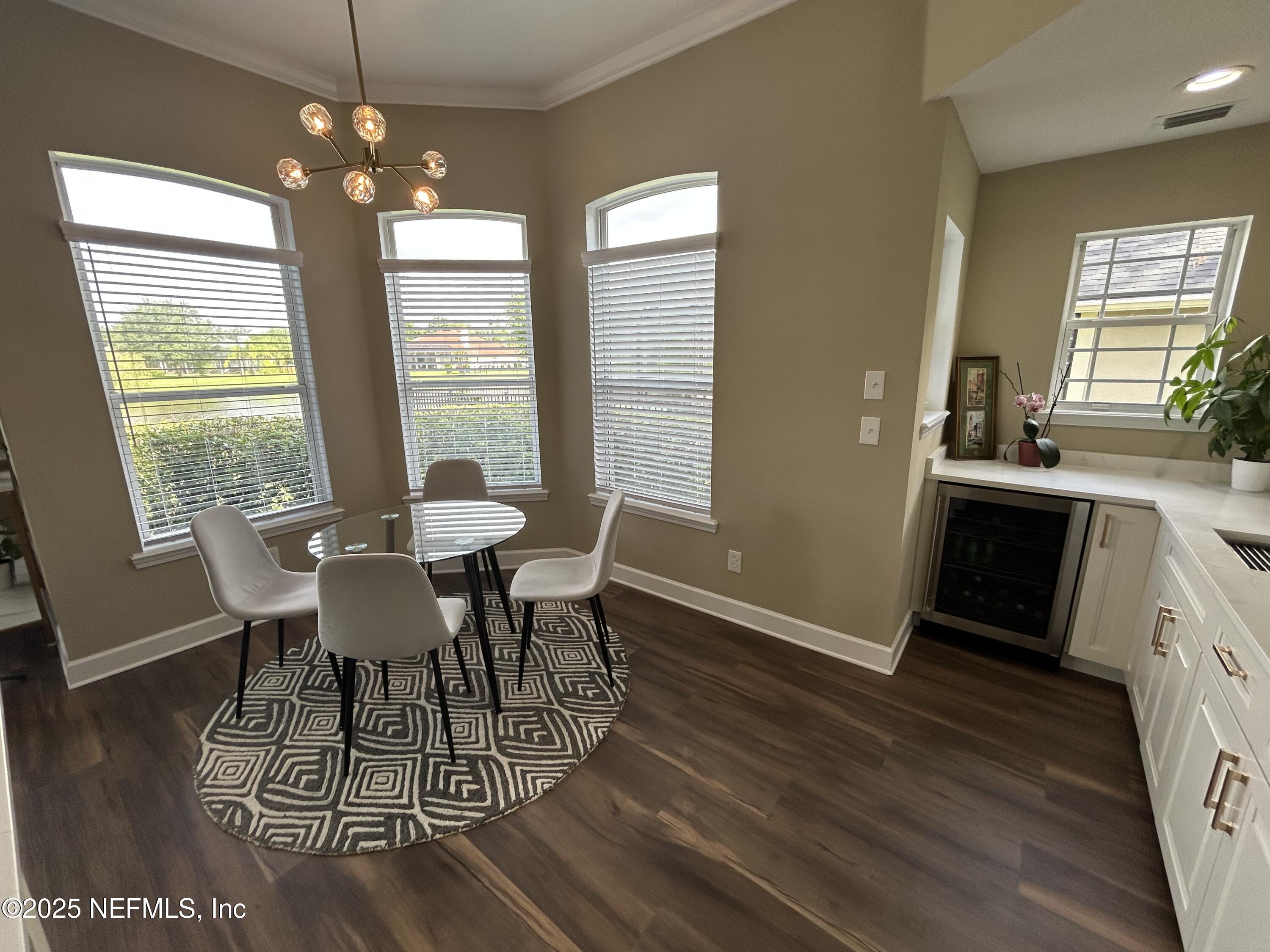 1764 Eagle Watch Drive Fleming Island, FL 32003 - Photo 15 of 41 a view of a dining room with furniture window and wooden floor