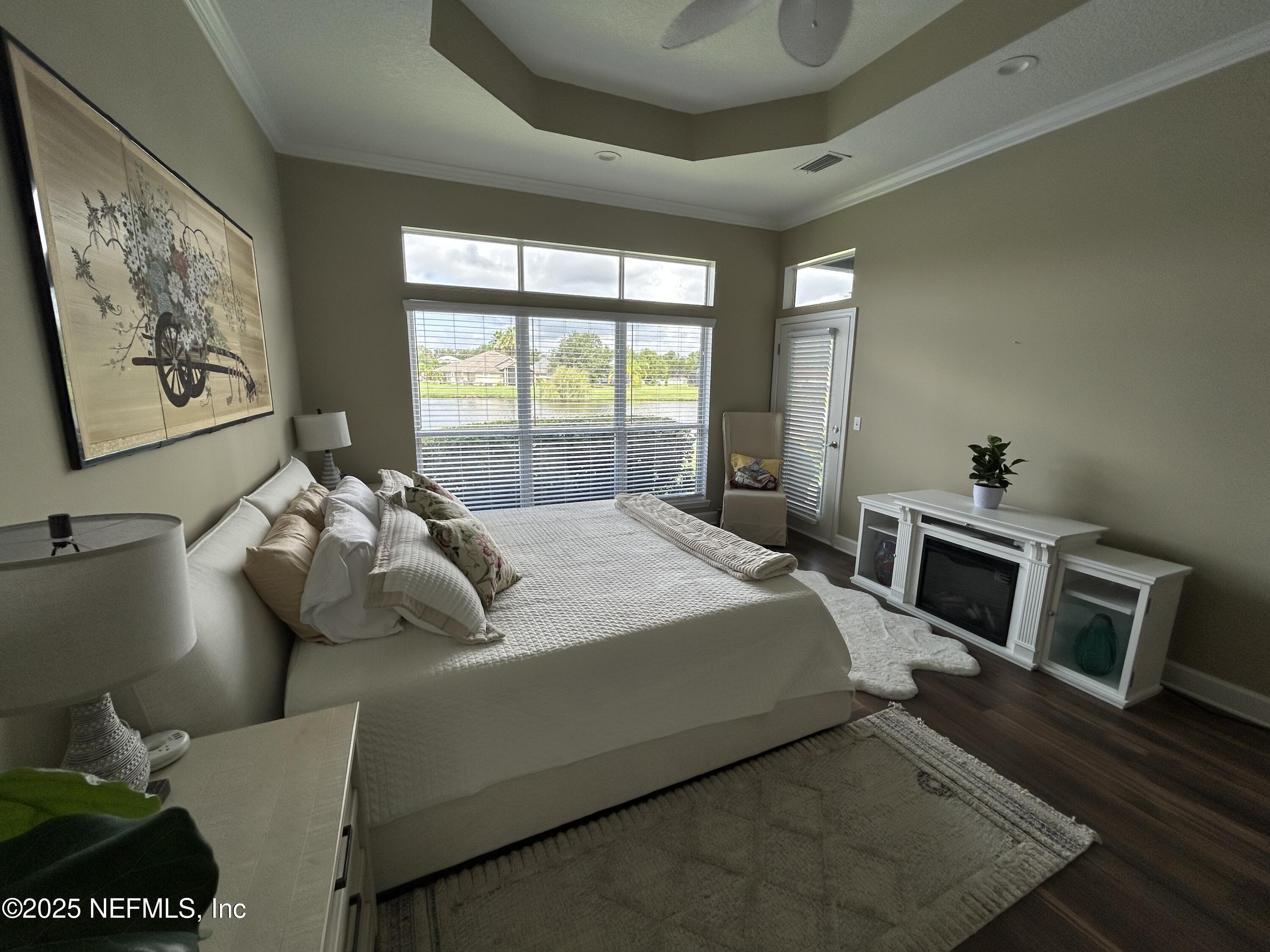 1764 Eagle Watch Drive Fleming Island, FL 32003 - Photo 20 of 41 a bedroom with a bed and wooden floor