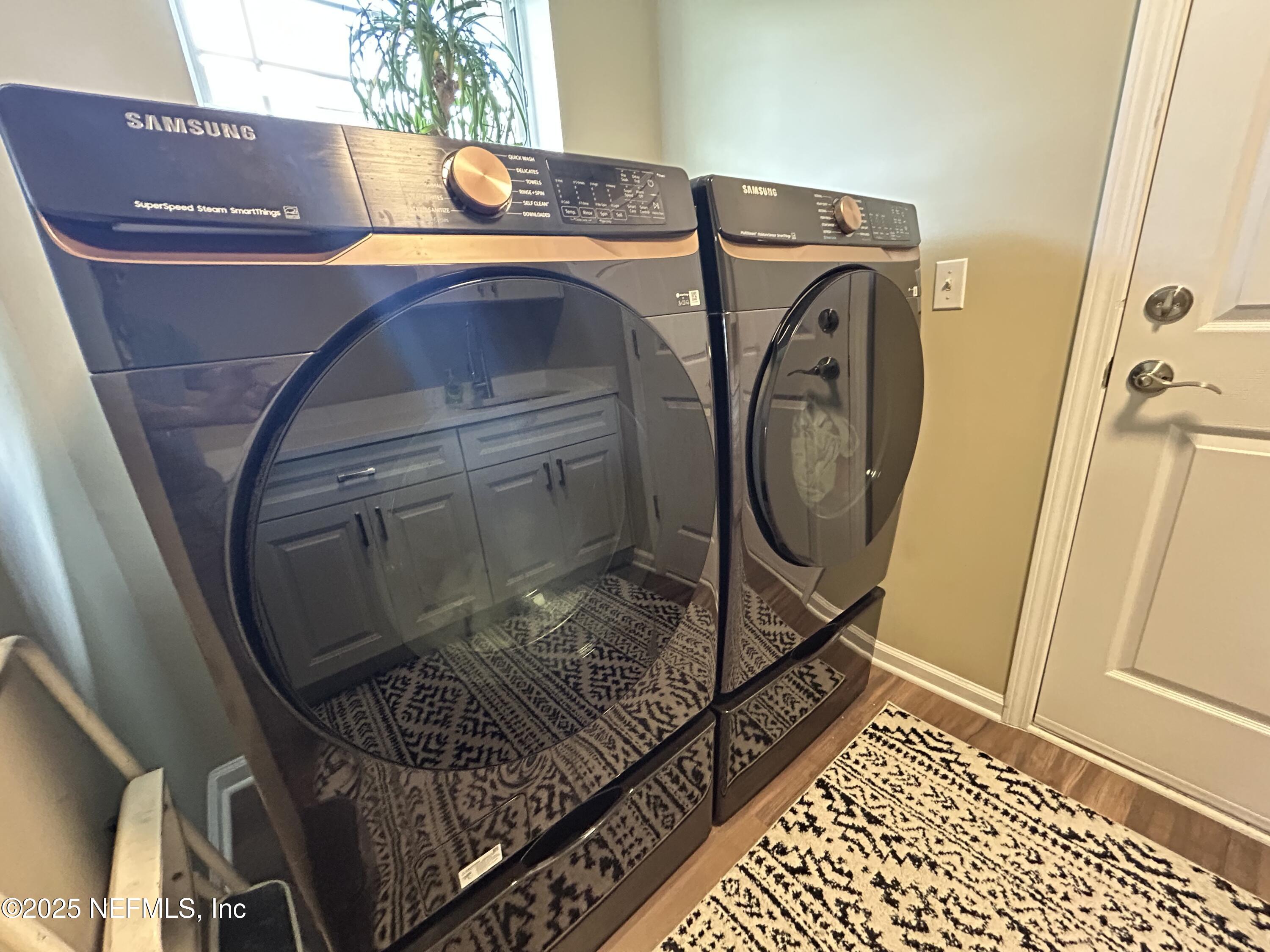 1764 Eagle Watch Drive Fleming Island, FL 32003 - Photo 28 of 41 a bathroom with a sink and a mirror