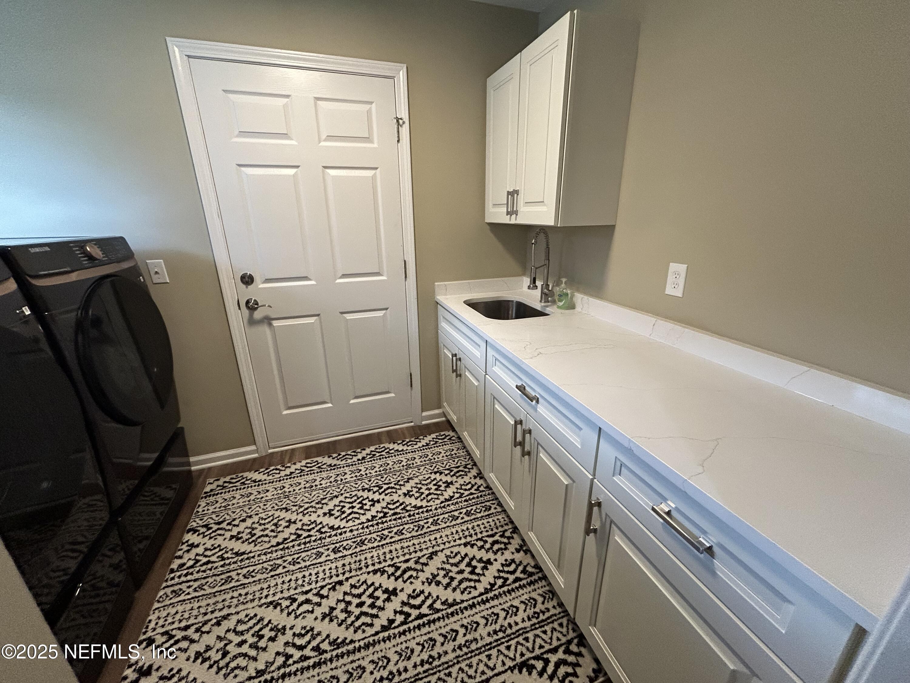 1764 Eagle Watch Drive Fleming Island, FL 32003 - Photo 29 of 41 a bathroom with a sink and a mirror