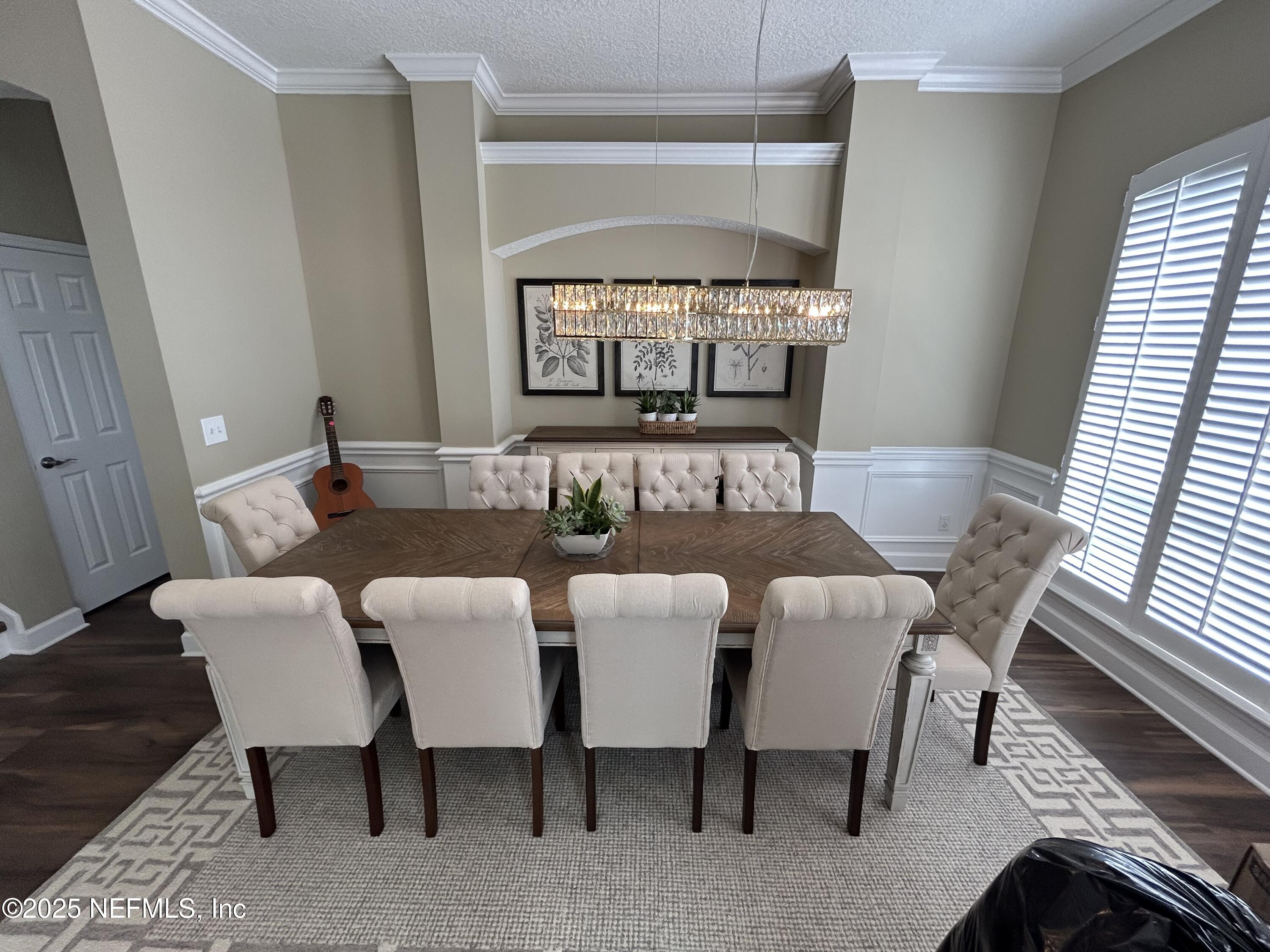 1764 Eagle Watch Drive Fleming Island, FL 32003 - Photo 3 of 41 a view of a dining room with furniture window and wooden floor