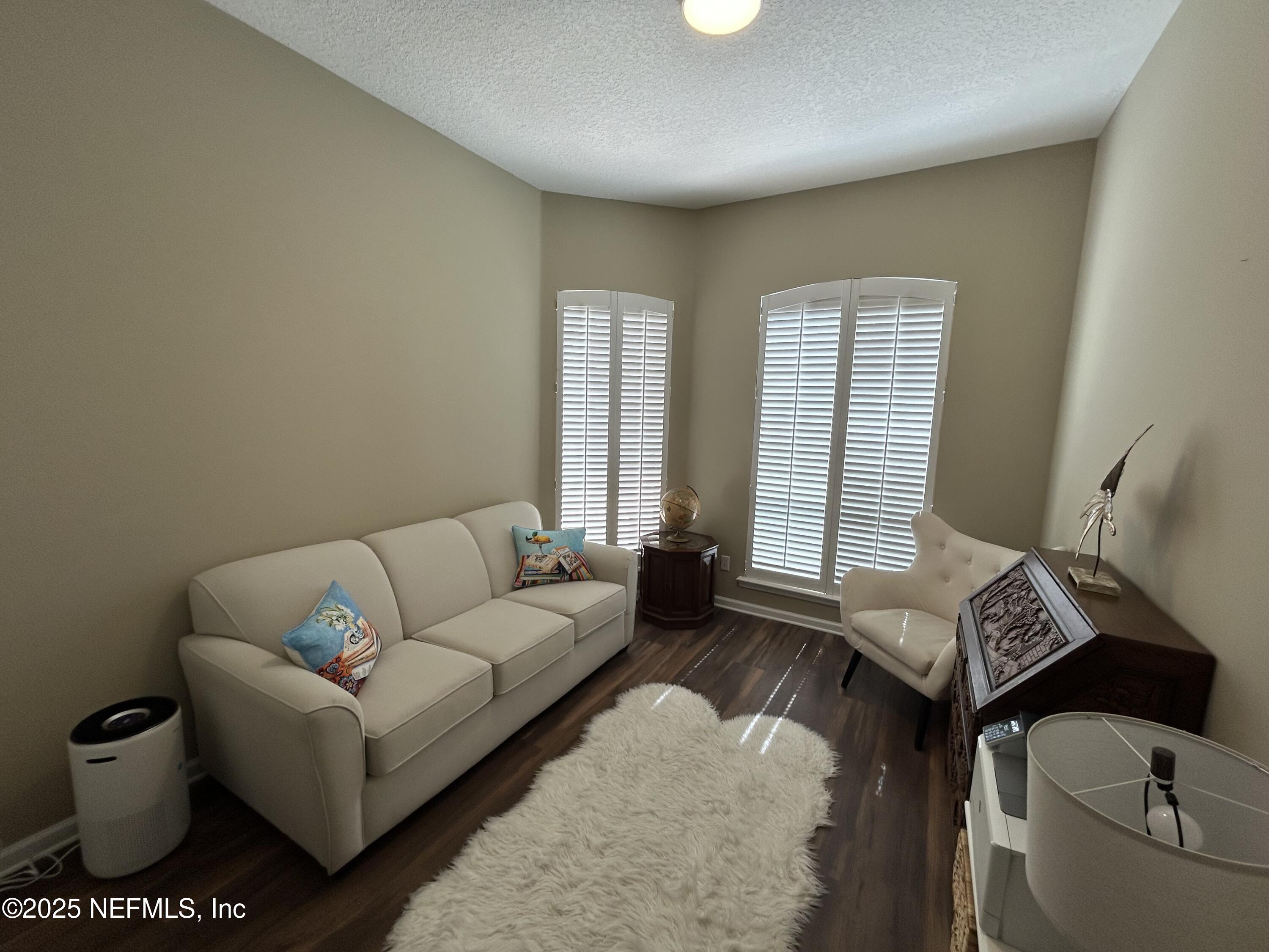 1764 Eagle Watch Drive Fleming Island, FL 32003 - Photo 35 of 41 a living room with furniture and a window