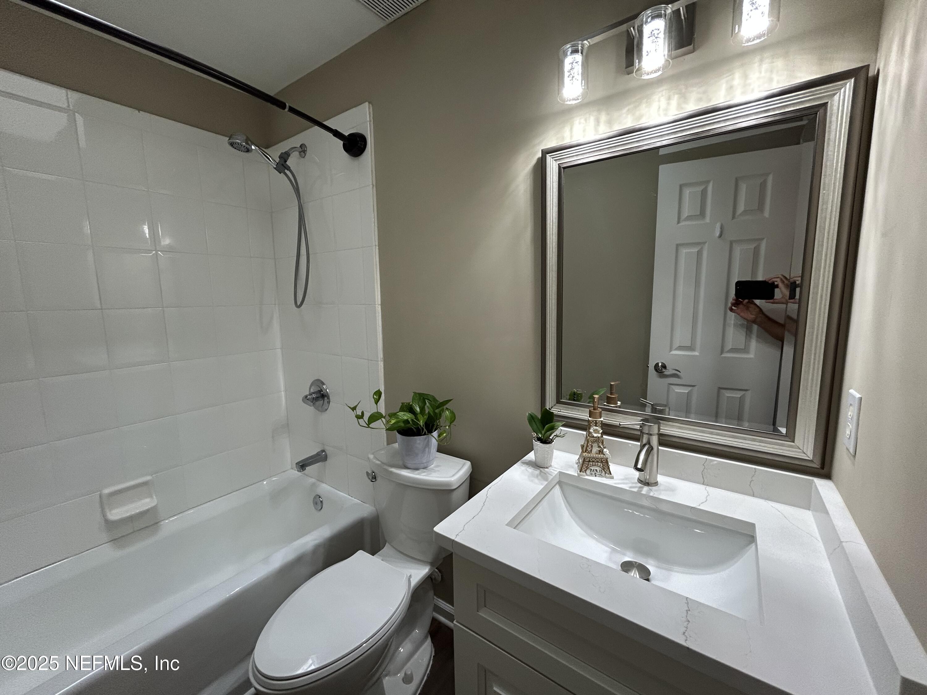 1764 Eagle Watch Drive Fleming Island, FL 32003 - Photo 37 of 41 a bathroom with a sink toilet tub and shower