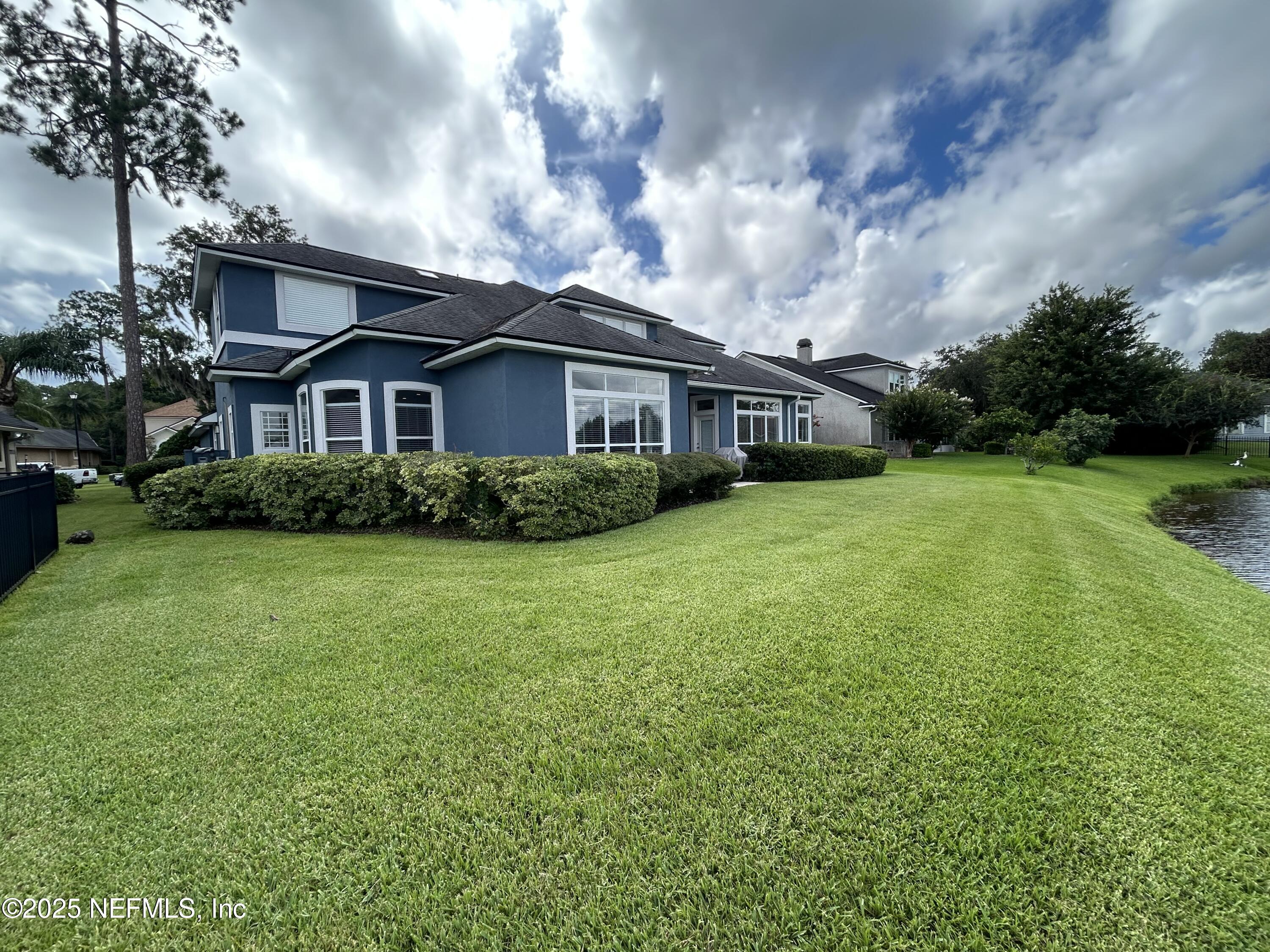 1764 Eagle Watch Drive Fleming Island, FL 32003 - Photo 38 of 41 a view of backyard of house with green space