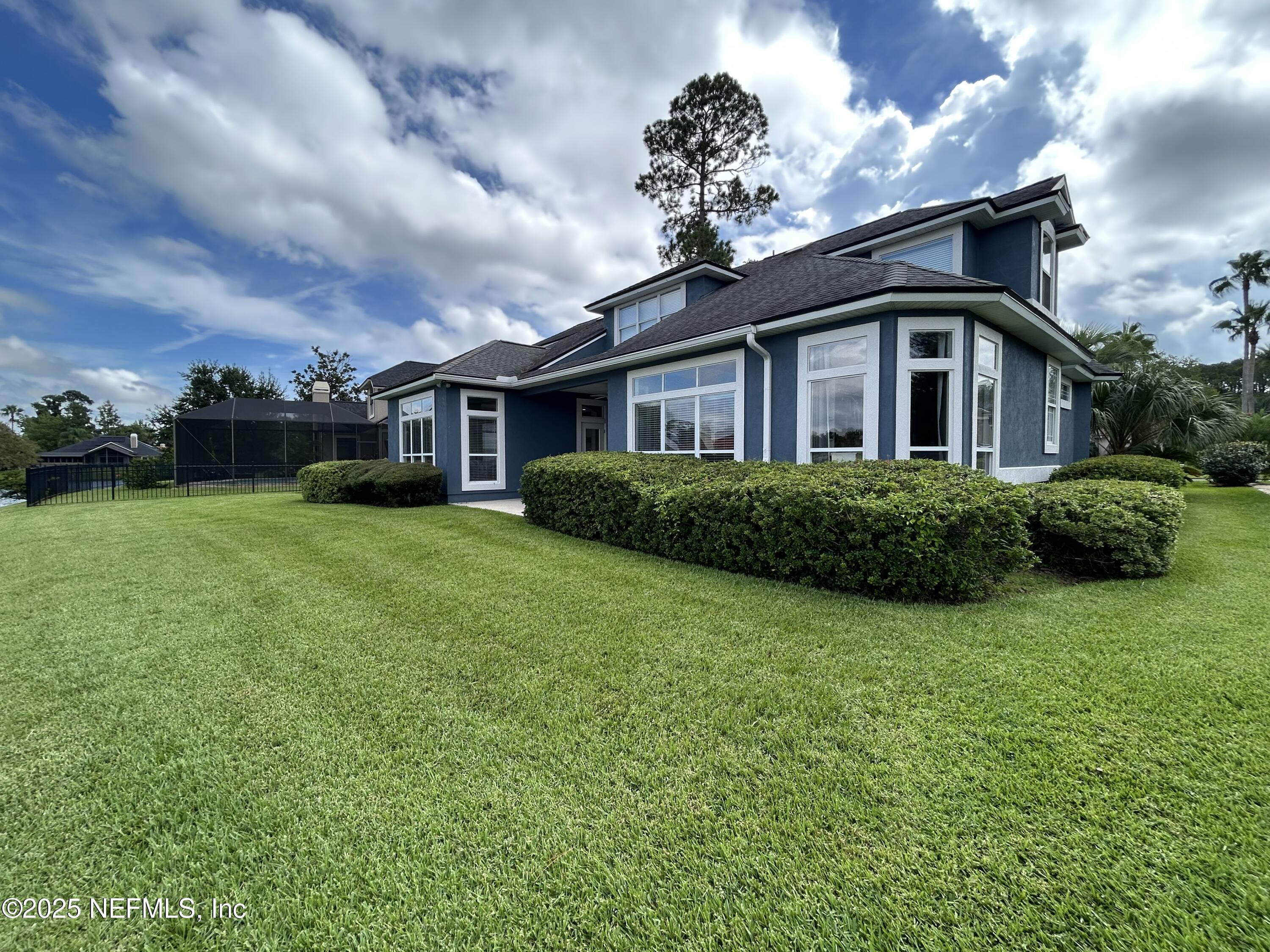 1764 Eagle Watch Drive Fleming Island, FL 32003 - Photo 40 of 41 a front view of a house with garden