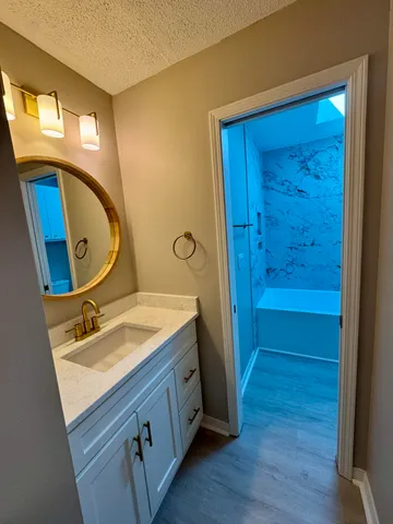 a bathroom with a tub and shower