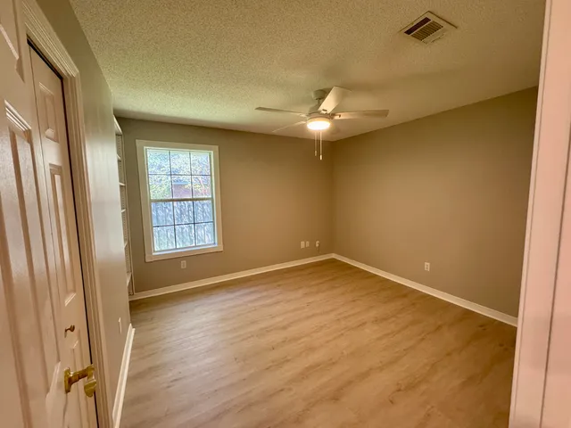 a bathroom with a sink a toilet and a shower