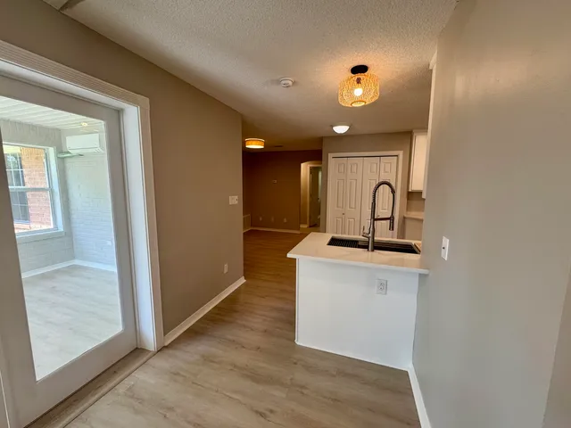 a kitchen with a sink and a refrigerator
