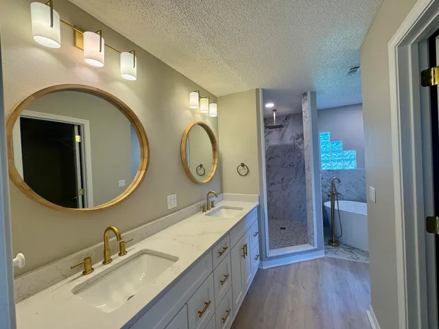 a bathroom with a double vanity sink and a mirror