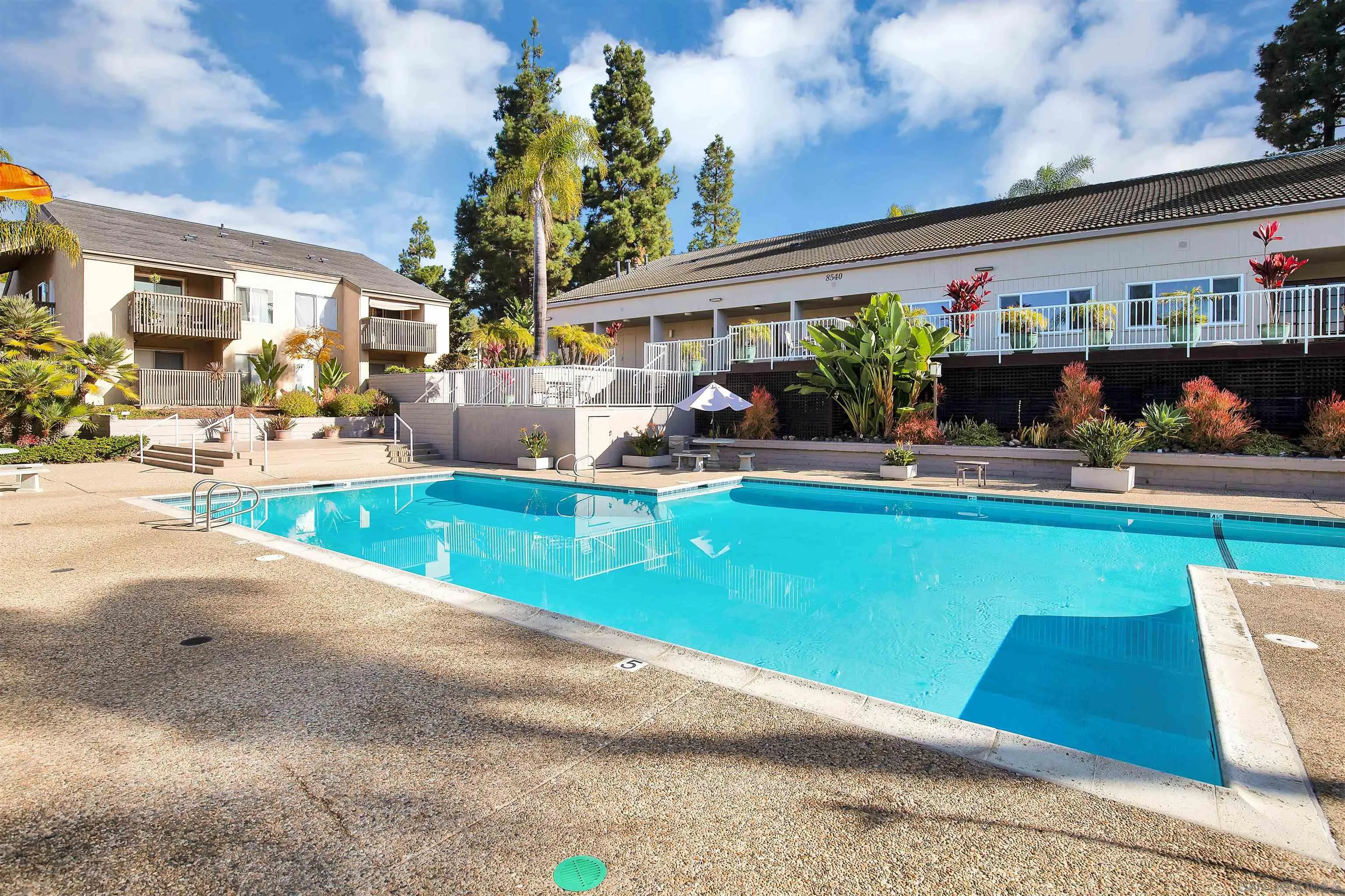 8541 Villa La Jolla Drive, Unit E La Jolla, CA 92037 - Photo 19 of 25 a view of swimming pool with outdoor seating