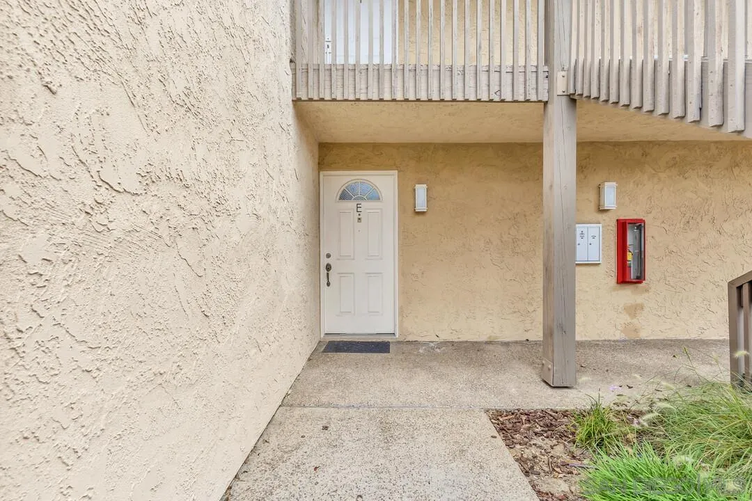 8541 Villa La Jolla Drive, Unit E La Jolla, CA 92037 - Photo 3 of 25 a view of a brick house with a wooden door