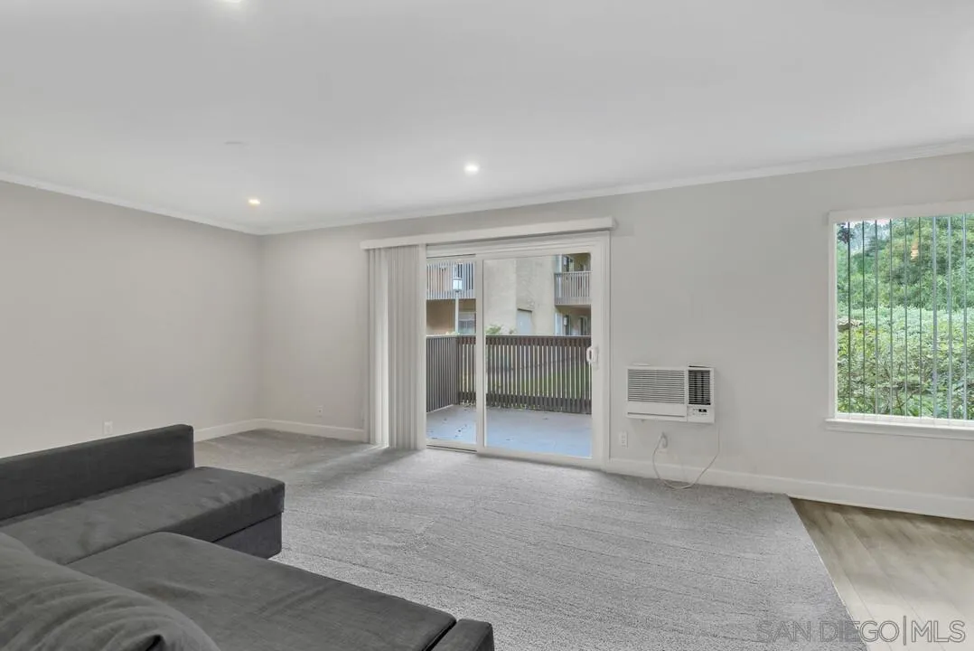 8541 Villa La Jolla Drive, Unit E La Jolla, CA 92037 - Photo 8 of 25 a view of livingroom with furniture and window