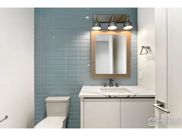 an empty room with windows and cabinet